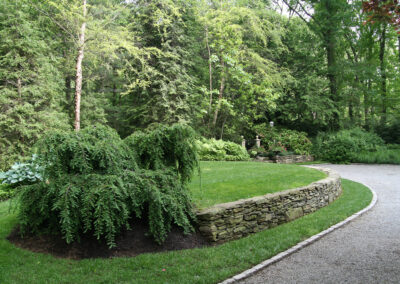 Natural stacked stone retaining wall.