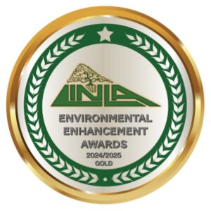 A gold and green circular badge titled Environmental Enhancement Awards featuring a tree logo at the top. It reads INLA and 2024/2025 Gold in the center, with laurel leaves encircling the design.